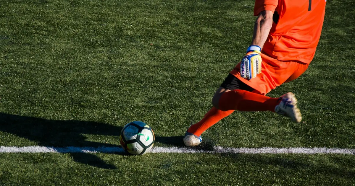 A player striking the ball along the touchline