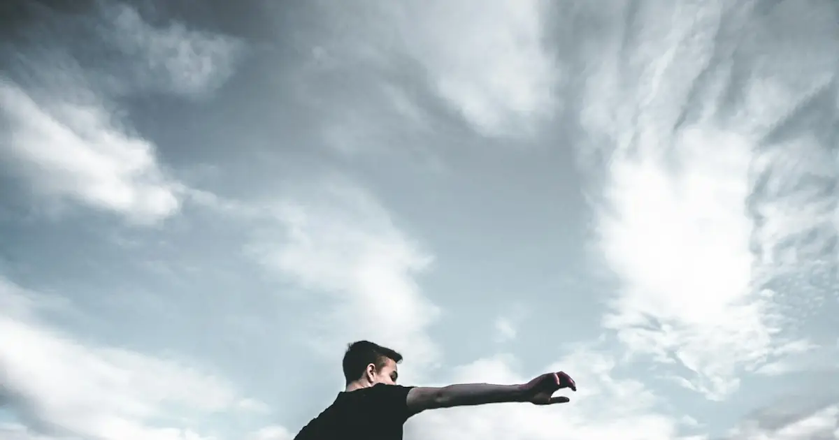 A player volleying a football towards goal